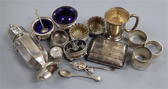 An Edwardian silver sugar caster, silver trinket box, silver salts, napkin rings, cigarette case and a 9ct gold cufflink